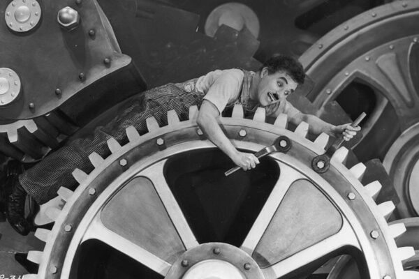 Charlie Chaplin benig devoured by a machine in Modern Times.