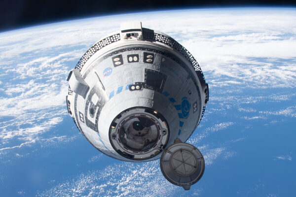 Boeing's CST-100 Starliner approaches the International Space Station on the company's Orbital Flight Test-2 mission.