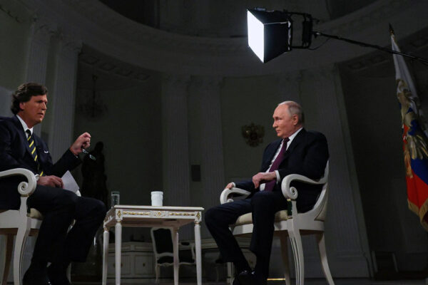 Tucker Carlson interviewing president of Russia Vladimir Putin.